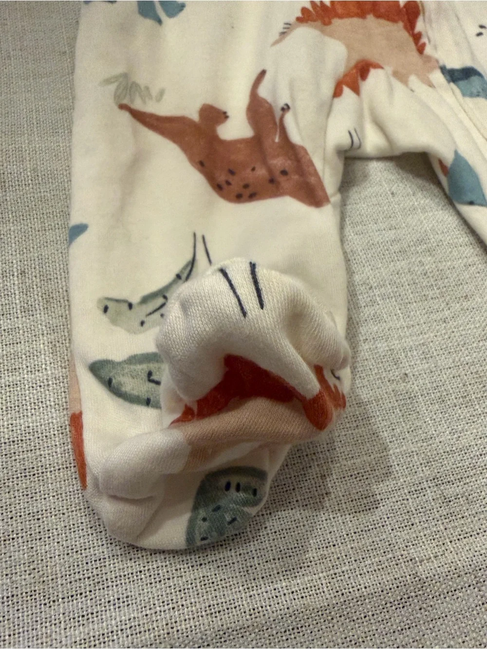 Carter's Cream Dino Print Footed One-Piece in Blue and Rust